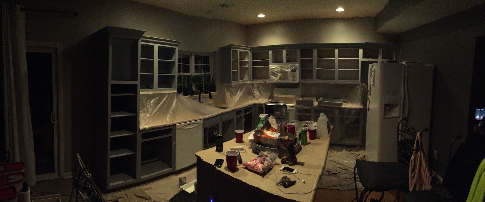 Full kitchen masked and prepped for a cabinet repaint